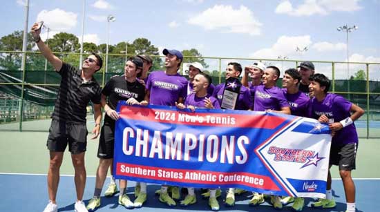 Knights men's tennis team with their SSAC Championship banner.